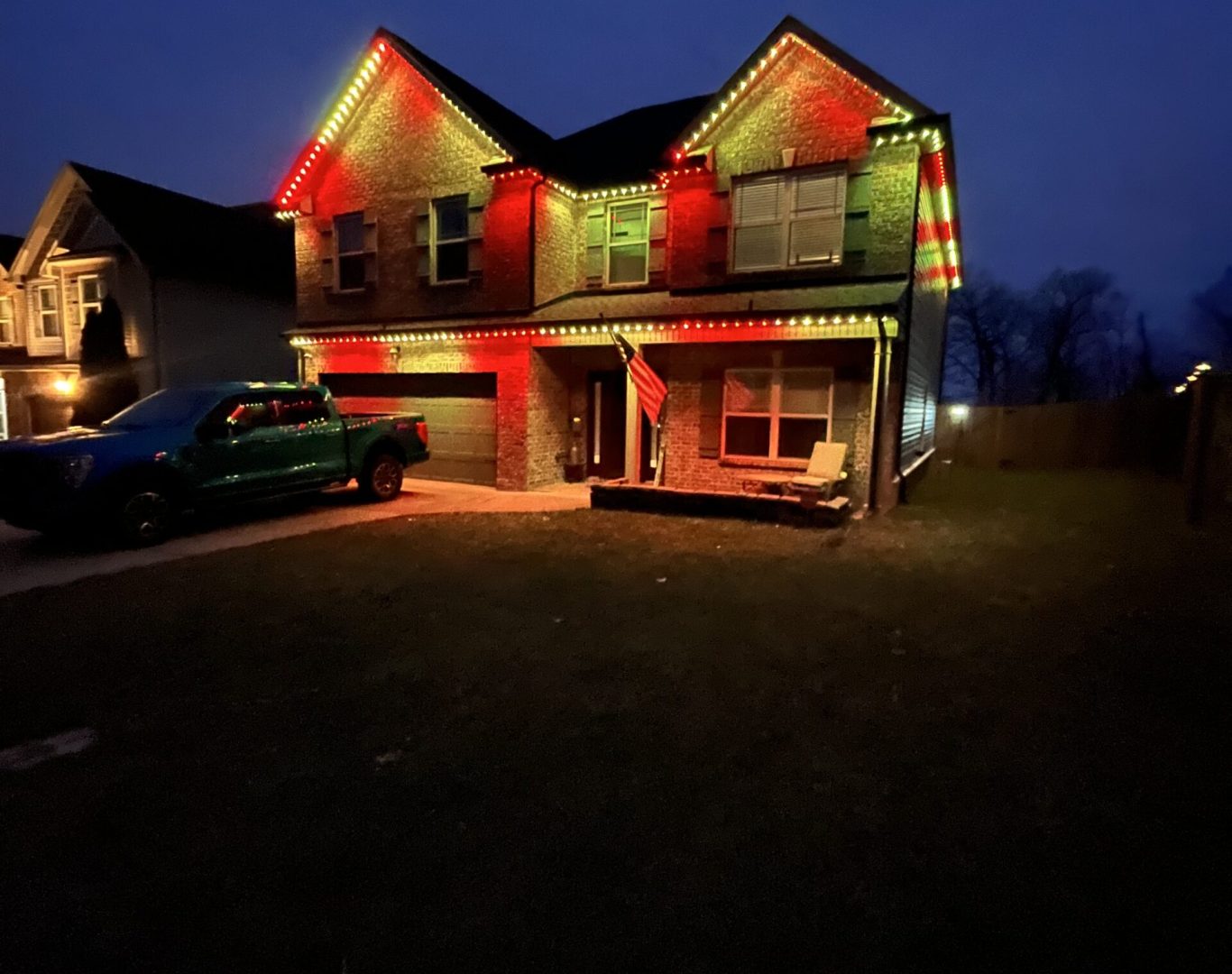 Clarksville Permanent Lighting team installing LED permanent lighting on a home exterior in Clarksville, TN.